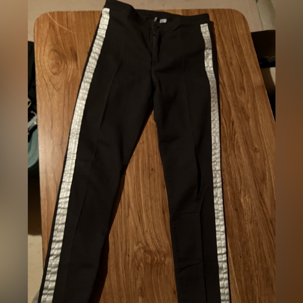 H&M black trousers either silver detail at the sides . Size 10